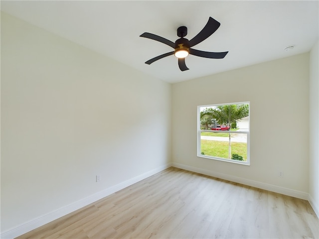 empty room with light hardwood / wood-style flooring and ceiling fan