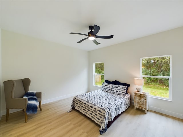 bedroom featuring light hardwood / wood-style flooring and ceiling fan