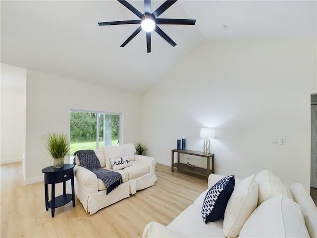 living room featuring high vaulted ceiling, light hardwood / wood-style flooring, and ceiling fan