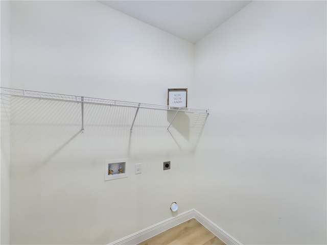 clothes washing area featuring washer hookup, electric dryer hookup, and wood-type flooring