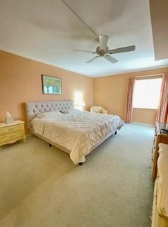 dining area with light colored carpet and crown molding