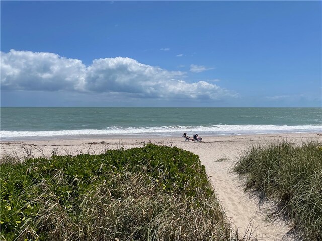 property view of water featuring a beach view