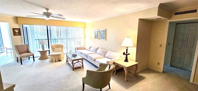 carpeted living room with crown molding, ceiling fan, and a textured ceiling