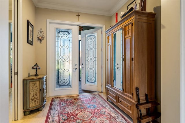 entryway featuring crown molding