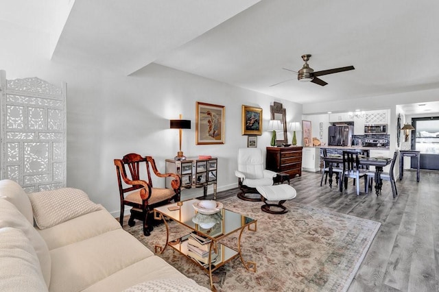 living room with hardwood / wood-style flooring and ceiling fan