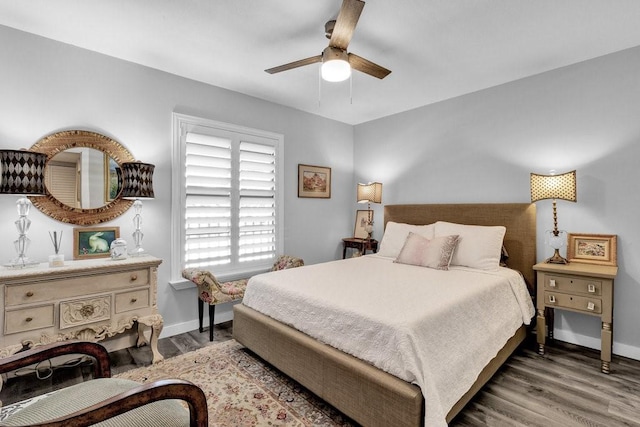 bedroom featuring ceiling fan and dark hardwood / wood-style floors