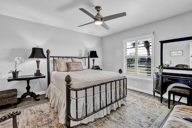 bedroom featuring hardwood / wood-style flooring and ceiling fan