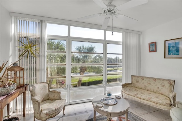 sunroom featuring a ceiling fan