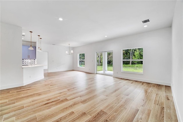 unfurnished living room featuring recessed lighting, visible vents, and light wood-style flooring