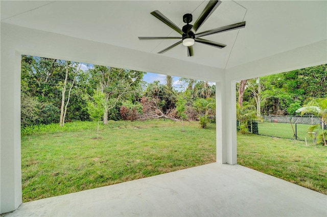 view of yard featuring a patio, ceiling fan, and fence