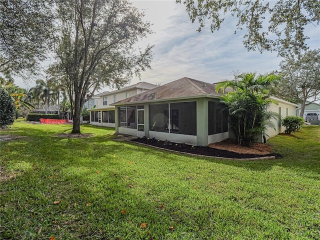 view of yard with a sunroom