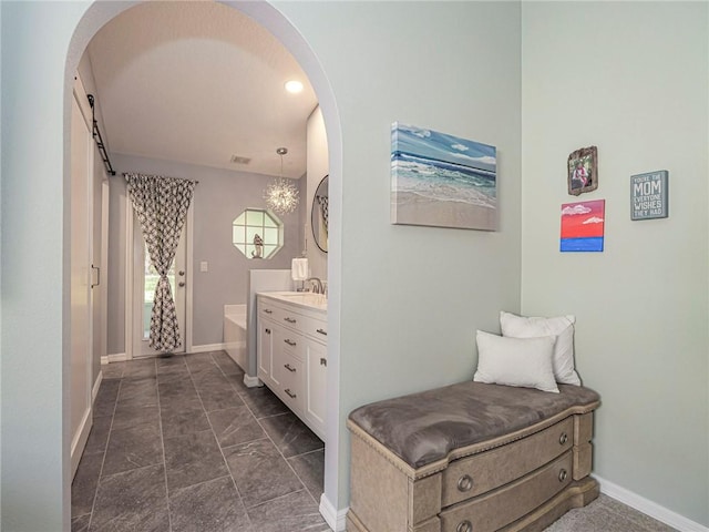 bathroom featuring vanity and a bathtub