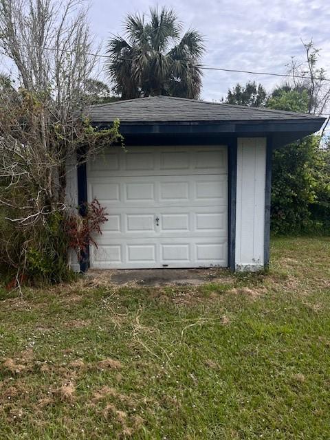 garage with a lawn