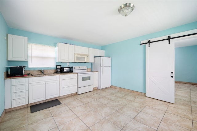 6225 S US Highway 1, Grant Valkaria, FL 32949 - kitchen with white appliances, a barn door, white cabinets, and light tile patterned flooring