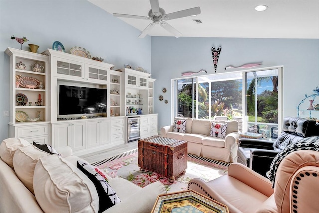 living room featuring vaulted ceiling, wine cooler, and ceiling fan