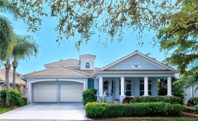 view of front of home with a porch and a garage