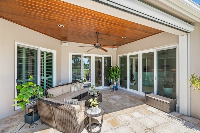 view of patio / terrace with ceiling fan and an outdoor living space