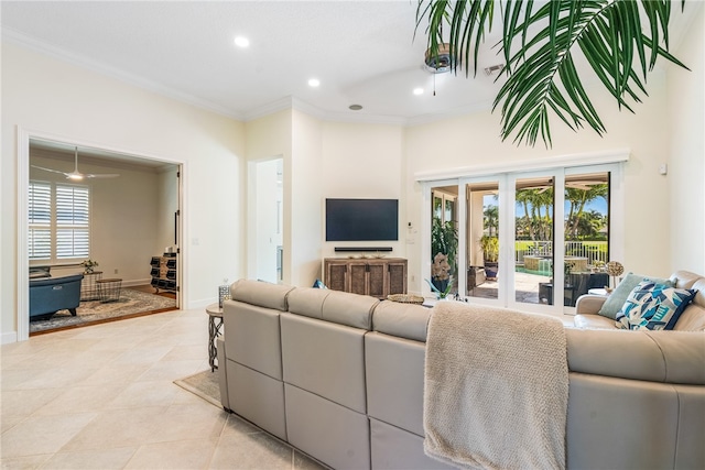 living area featuring a wealth of natural light, crown molding, baseboards, and recessed lighting