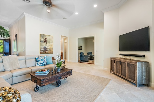 living room featuring baseboards, a ceiling fan, light tile patterned flooring, crown molding, and recessed lighting