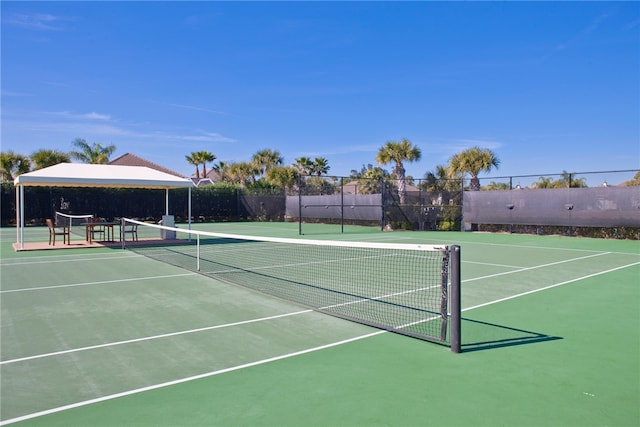 view of sport court featuring community basketball court and fence