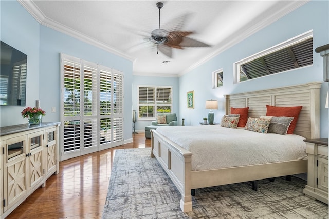 bedroom with ornamental molding, access to outside, ceiling fan, and wood finished floors