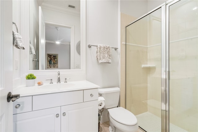 full bath featuring vanity, ornamental molding, a shower stall, and toilet