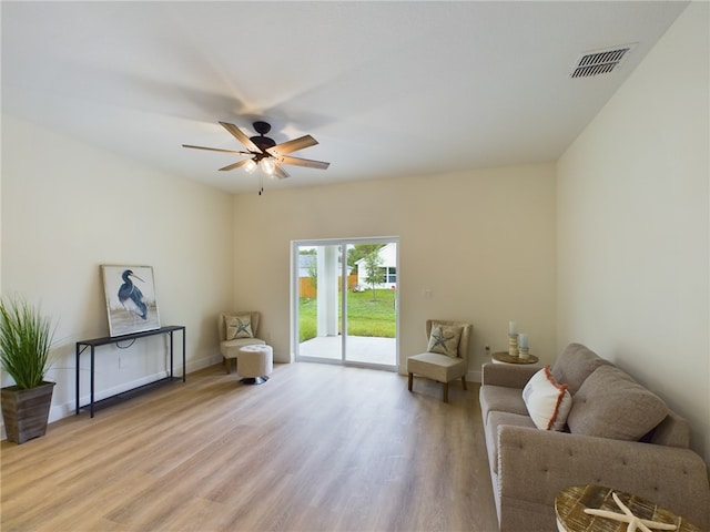 sitting room featuring ceiling fan and light wood-type flooring