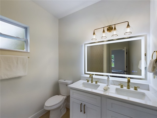 bathroom with vanity and toilet