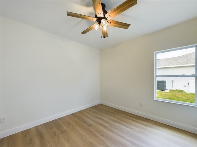 empty room with light wood-type flooring and ceiling fan