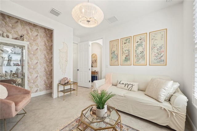 living room featuring a notable chandelier