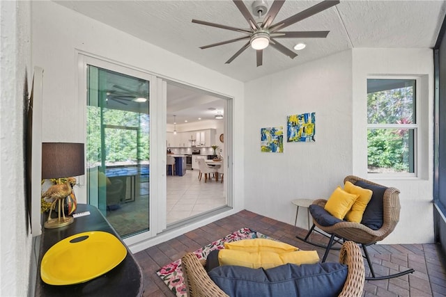 sunroom / solarium with ceiling fan