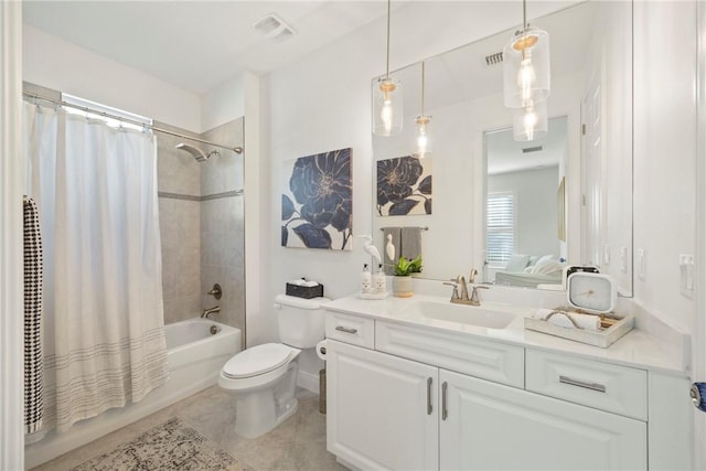 full bathroom featuring tile patterned flooring, shower / tub combo with curtain, vanity, and toilet