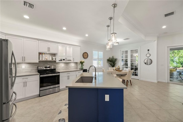 kitchen with white cabinetry, a kitchen island with sink, and appliances with stainless steel finishes