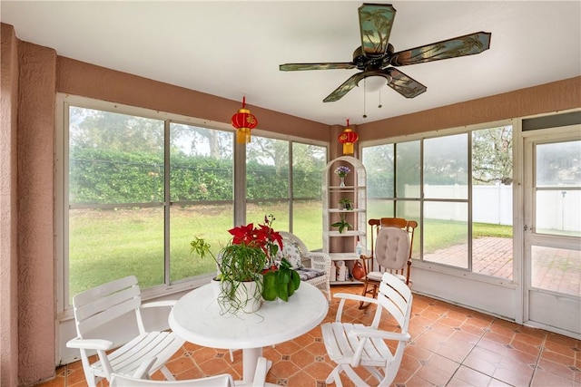 sunroom / solarium with ceiling fan