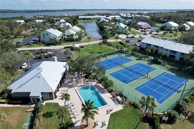 birds eye view of property with a water view