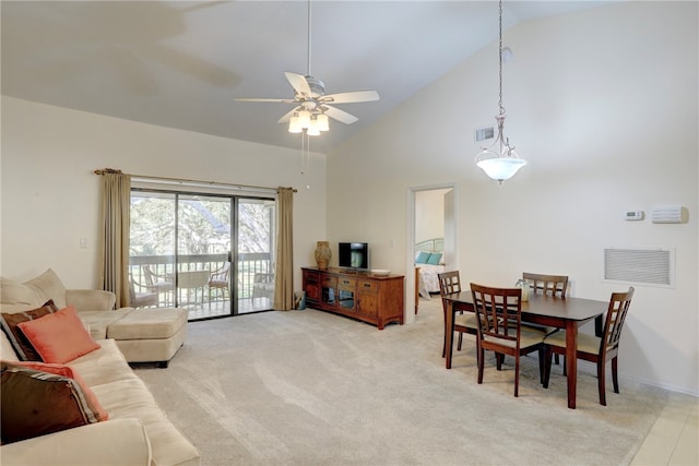 carpeted living room featuring ceiling fan and high vaulted ceiling