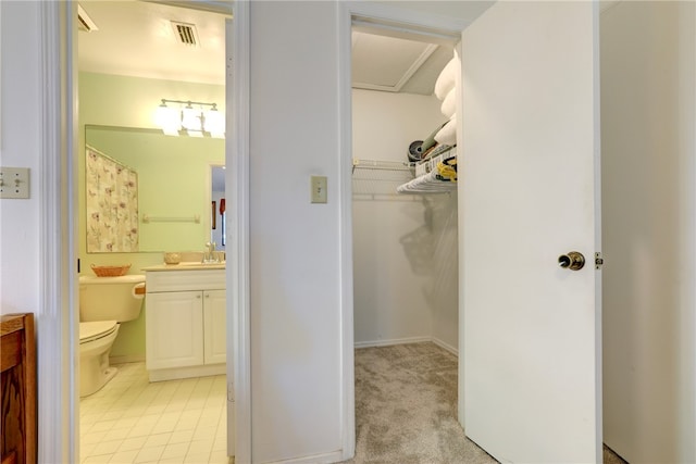 bathroom with vanity and toilet