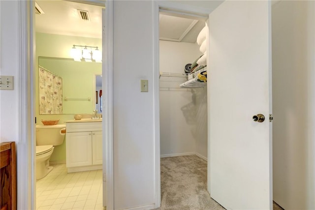 5760 Marina Dr Unit 4, Sebastian, FL 32958 - full bathroom with vanity, a spacious closet, and a shower with shower curtain