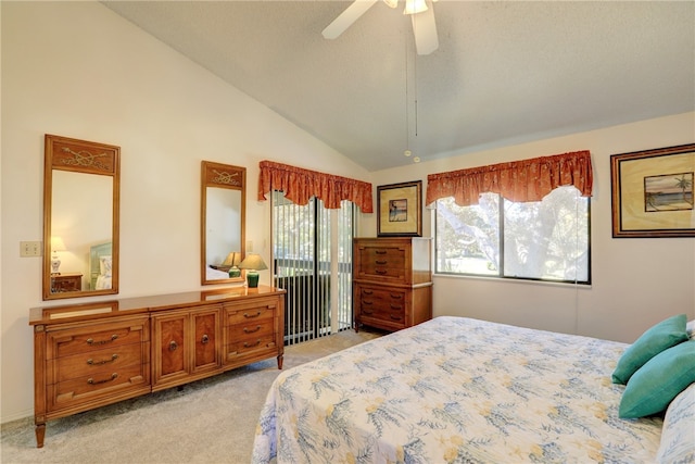 bedroom featuring ceiling fan, high vaulted ceiling, light colored carpet, and a textured ceiling