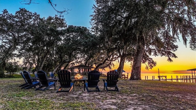 449 S Garcon Point Rd Fl, Milton, FL 32583 - view of yard featuring an outdoor fire pit and a water view