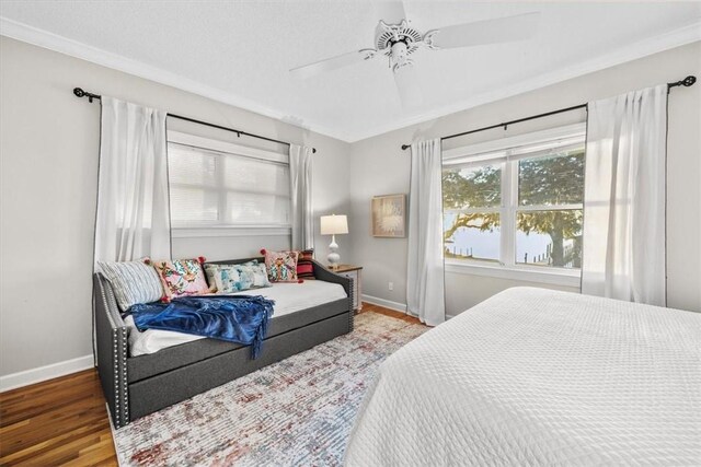 449 S Garcon Point Rd Fl, Milton, FL 32583 - bedroom with wood finished floors and a ceiling fan