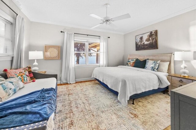 449 S Garcon Point Rd Fl, Milton, FL 32583 - bedroom with wood finished floors, crown molding, and ceiling fan