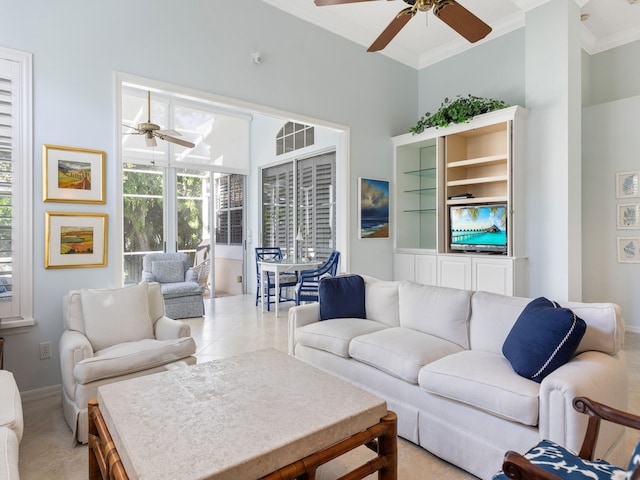 living room featuring ceiling fan, light tile patterned floors, and crown molding