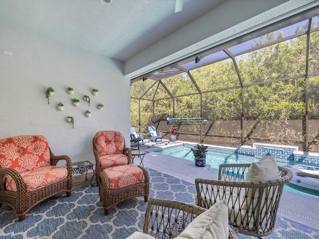 view of patio featuring an outdoor pool and a lanai