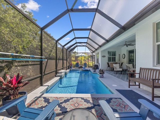 view of swimming pool featuring a fenced in pool, a patio, a ceiling fan, and an outdoor hangout area