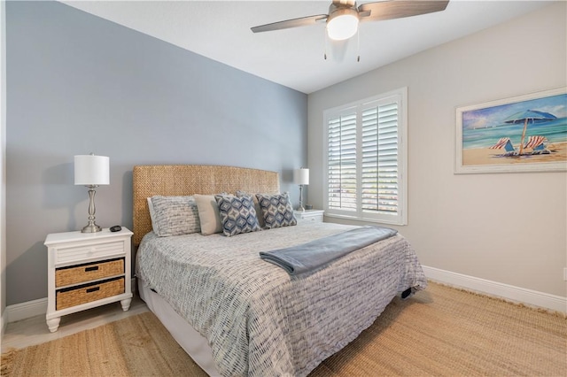 bedroom with baseboards and ceiling fan