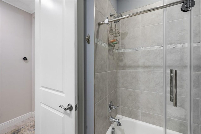 full bathroom with baseboards, enclosed tub / shower combo, and crown molding