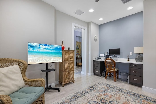 office featuring recessed lighting, light wood-style floors, visible vents, and baseboards