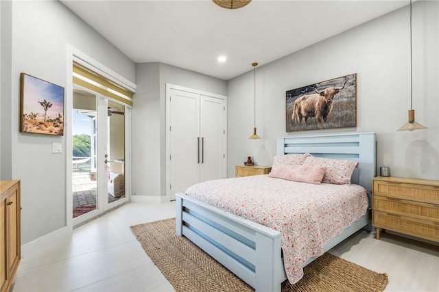 bedroom featuring a closet, recessed lighting, baseboards, and access to outside