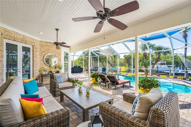 view of patio / terrace featuring an outdoor pool, french doors, an outdoor hangout area, and glass enclosure